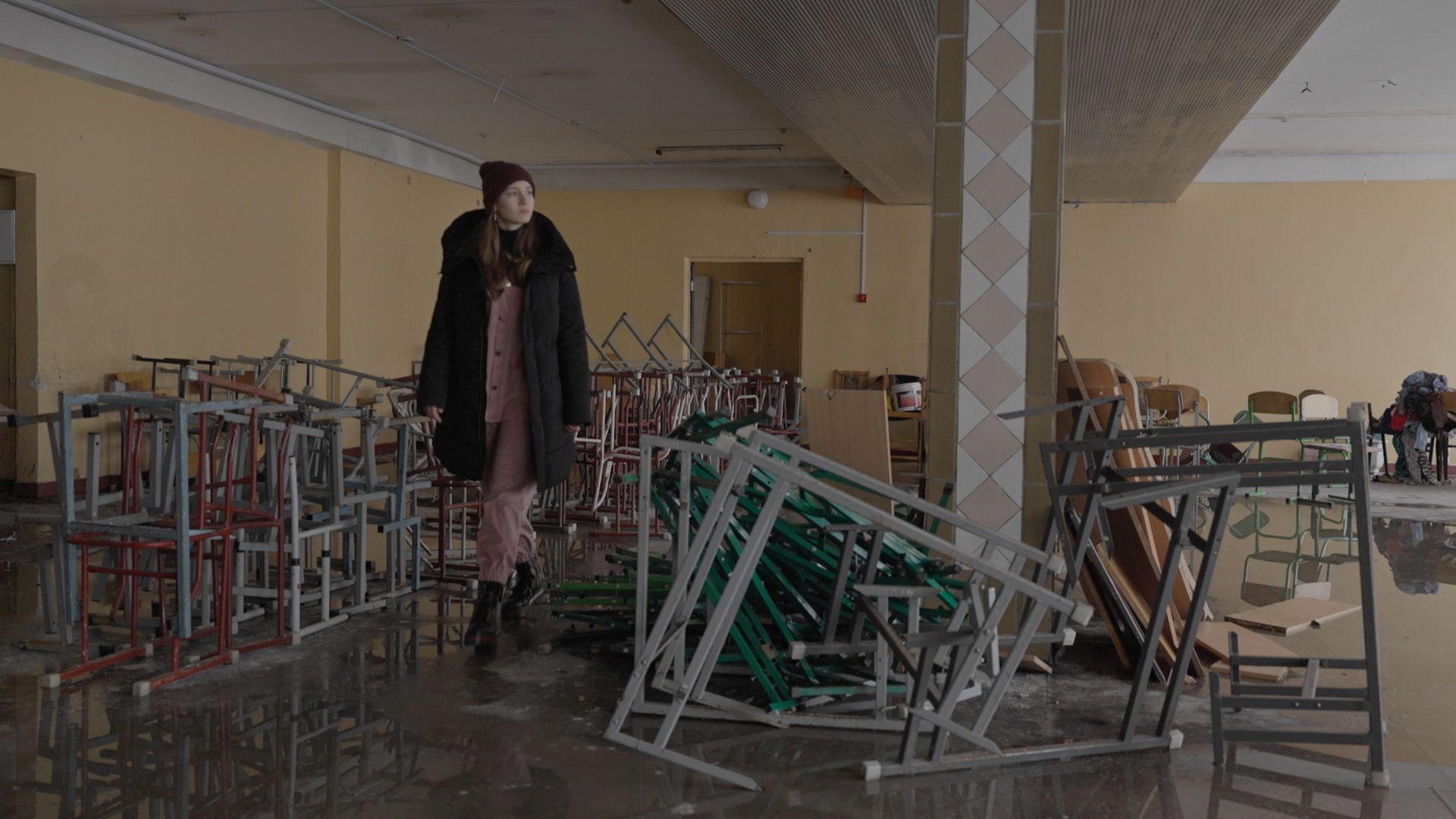 14-year-old Sonia walks through her damaged school in Irpin, Ukraine